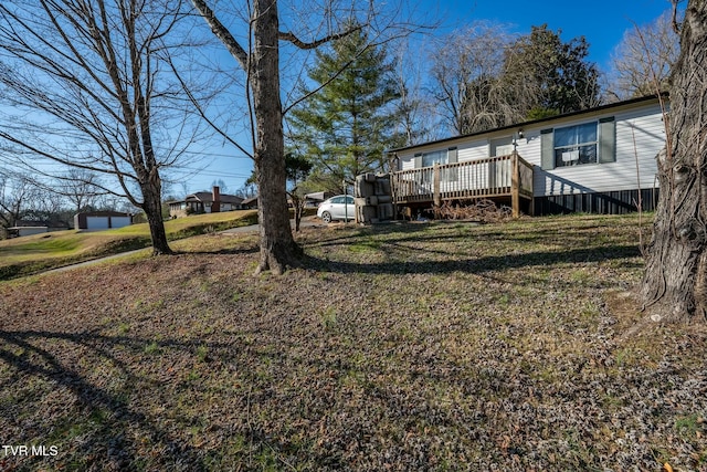 view of yard with a deck