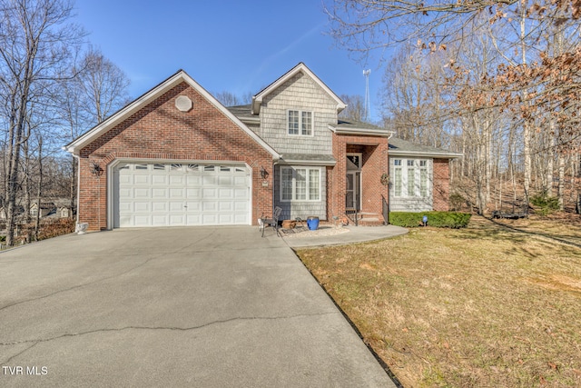 view of property featuring a front yard and a garage