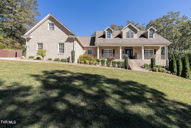 view of front of house featuring a front yard and a porch