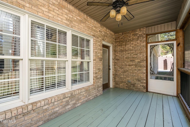 wooden deck with ceiling fan