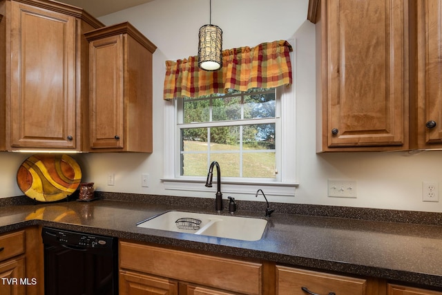 kitchen featuring dishwasher, sink, and decorative light fixtures