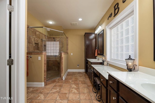 bathroom with vanity, tile patterned floors, and an enclosed shower