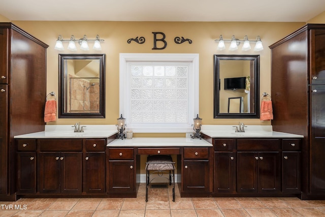 bathroom with tile patterned flooring and vanity