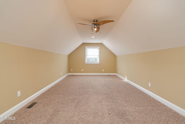 bonus room featuring ceiling fan, carpet floors, and vaulted ceiling