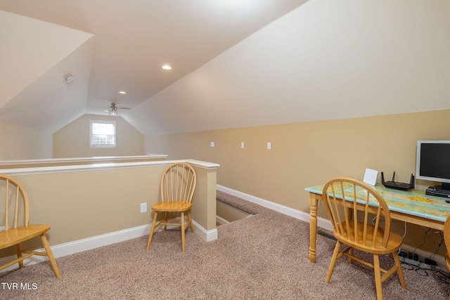 home office featuring ceiling fan, carpet floors, and vaulted ceiling