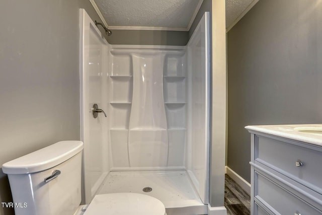 bathroom with a shower, a textured ceiling, and toilet