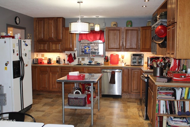 kitchen with dishwasher, white fridge with ice dispenser, hanging light fixtures, sink, and tasteful backsplash