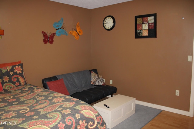 bedroom featuring hardwood / wood-style floors