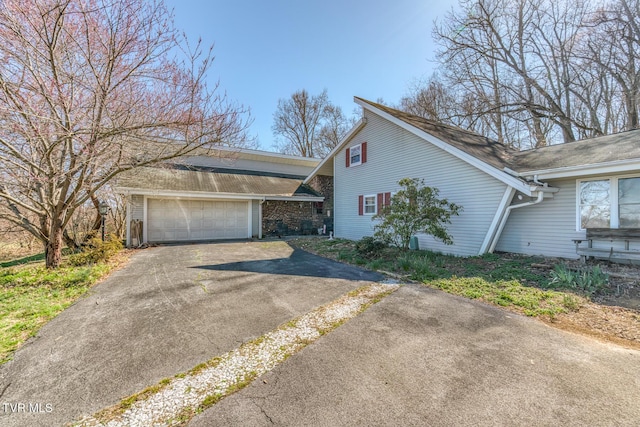 view of front of house featuring driveway and a garage