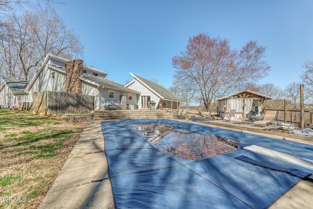 view of pool with a deck and fence