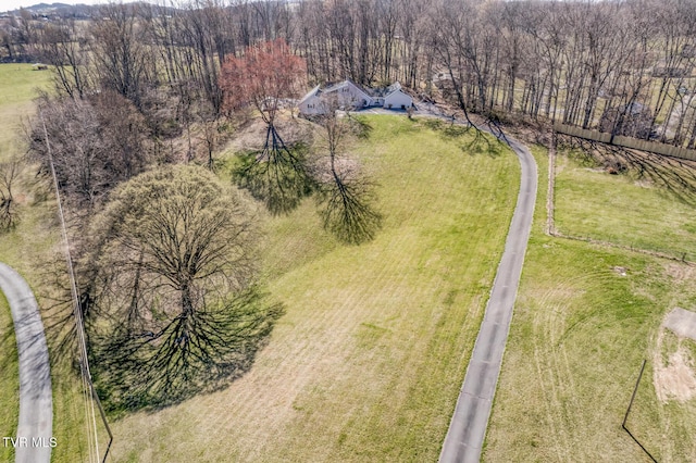 birds eye view of property with a rural view