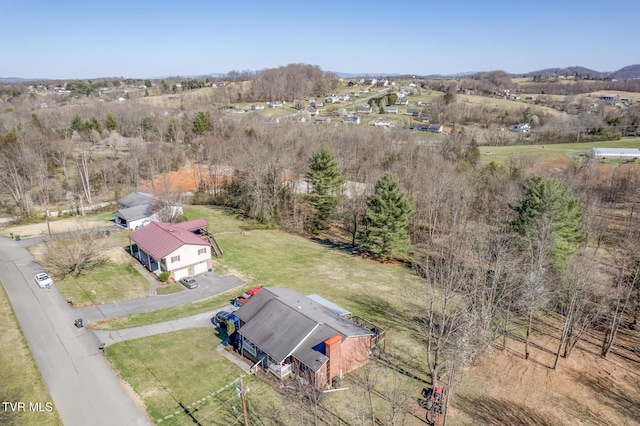 birds eye view of property with a rural view