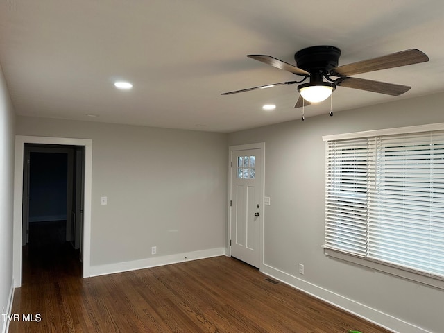 entryway with ceiling fan and dark hardwood / wood-style floors