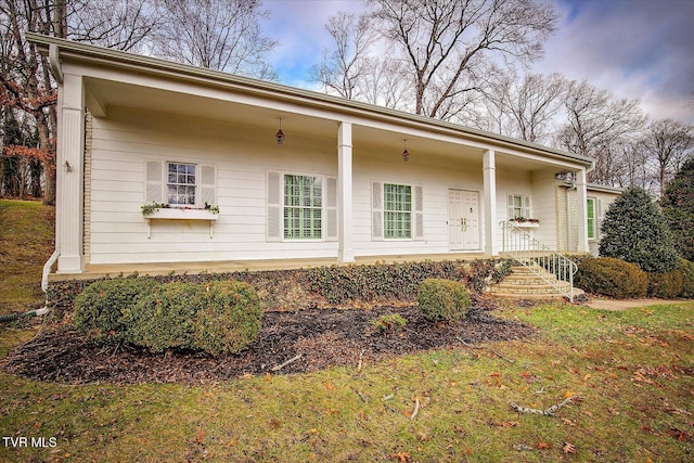 back of house featuring covered porch