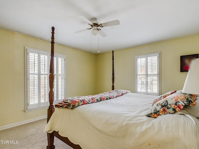 bedroom featuring ceiling fan and light carpet