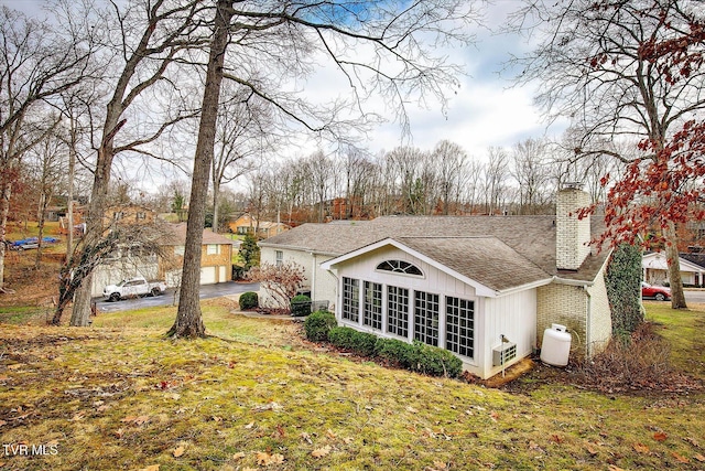 rear view of house with a yard