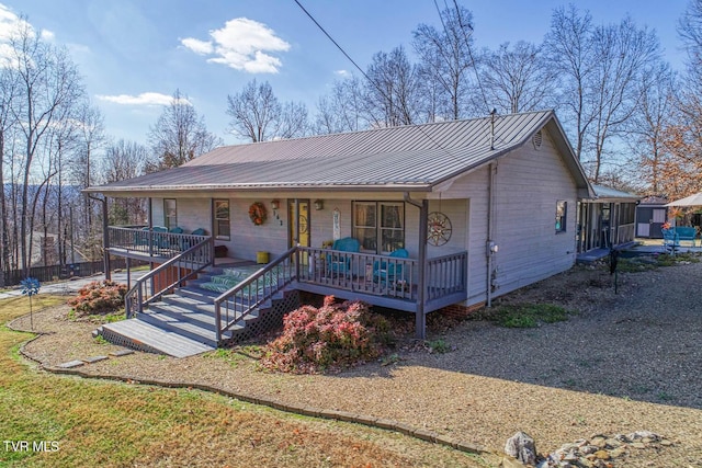 ranch-style house with covered porch