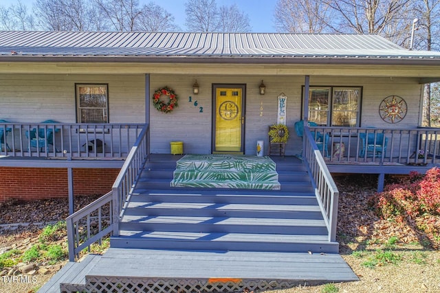 property entrance with covered porch