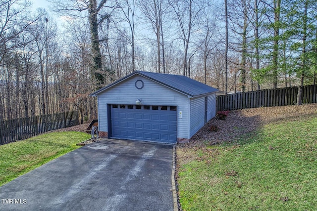 garage featuring a yard