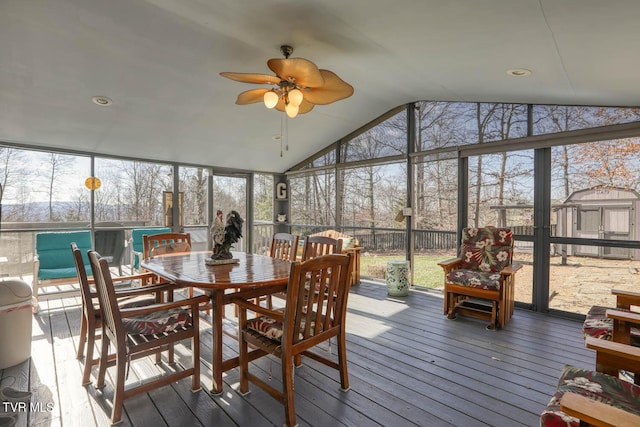 sunroom featuring ceiling fan and vaulted ceiling