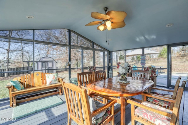 sunroom with ceiling fan and lofted ceiling