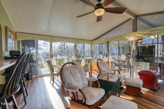 sunroom / solarium with vaulted ceiling with beams, ceiling fan, and plenty of natural light