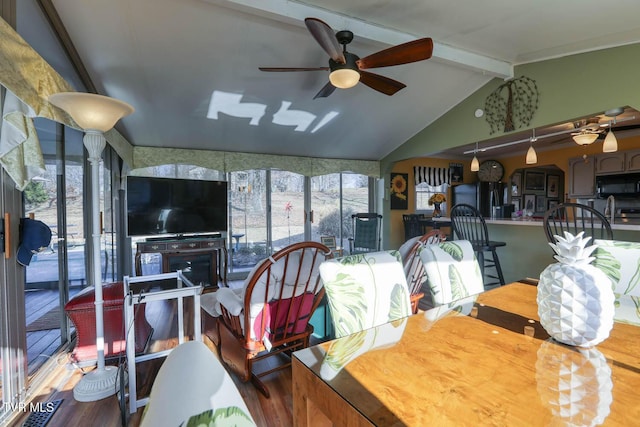 dining room with lofted ceiling with beams, a wealth of natural light, and ceiling fan