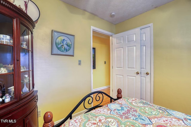 bedroom featuring a textured ceiling