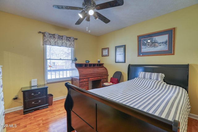 bedroom featuring light hardwood / wood-style flooring and ceiling fan