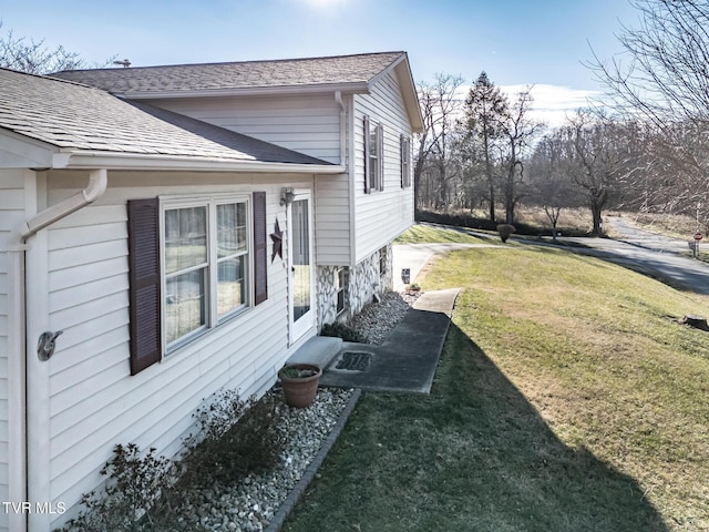 view of home's exterior featuring a yard