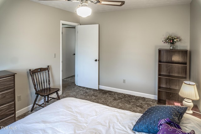 bedroom with dark colored carpet and ceiling fan