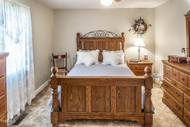 bedroom featuring light carpet