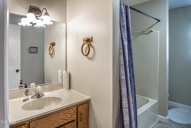 bathroom with shower / bath combo with shower curtain and vanity