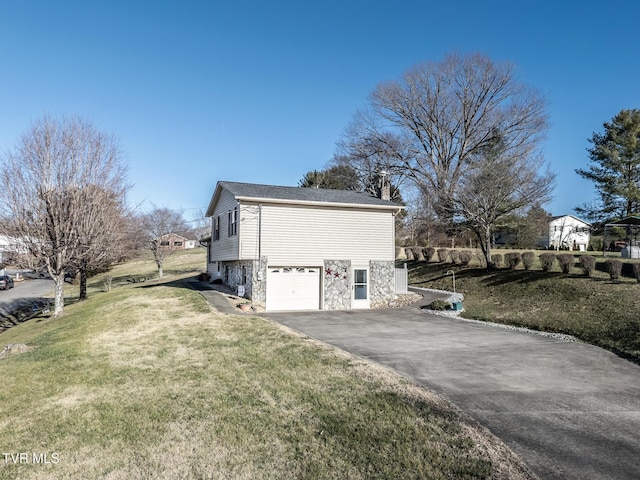 view of property exterior with a yard and a garage