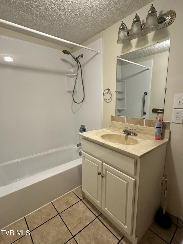 bathroom with vanity, bathtub / shower combination, a textured ceiling, and tile patterned floors