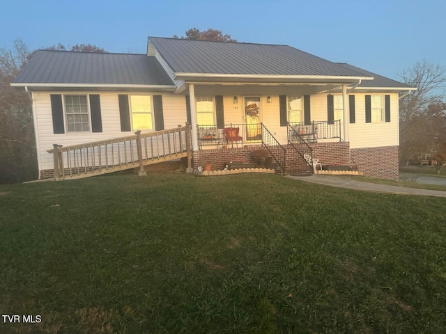 single story home with a porch and a front yard