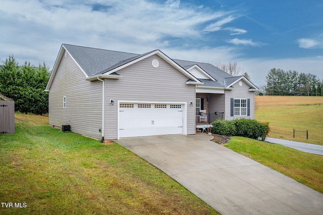 view of front of property featuring a front lawn and a garage