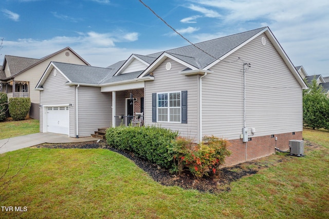 view of front of house featuring a front yard, a garage, and central AC unit