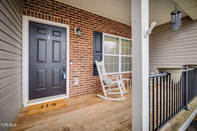 entrance to property featuring covered porch