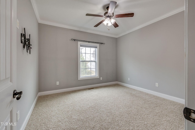 unfurnished room featuring carpet flooring, ceiling fan, and ornamental molding