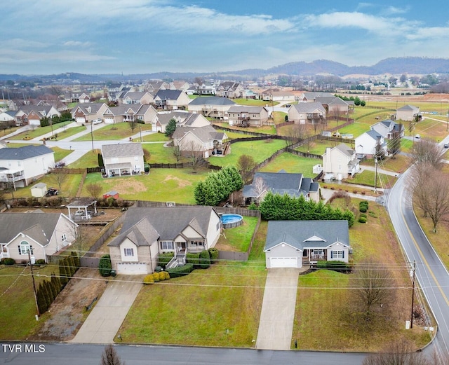 birds eye view of property with a mountain view