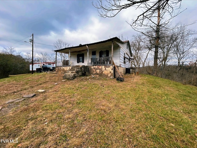 view of front of home featuring a front yard and a porch