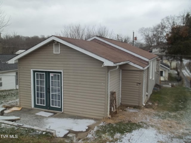 view of side of property featuring french doors