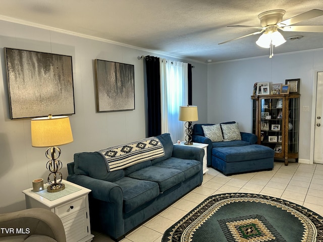 living room featuring a textured ceiling, ceiling fan, light tile patterned floors, and crown molding