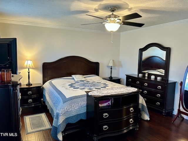 bedroom with ceiling fan, dark hardwood / wood-style flooring, a textured ceiling, and crown molding