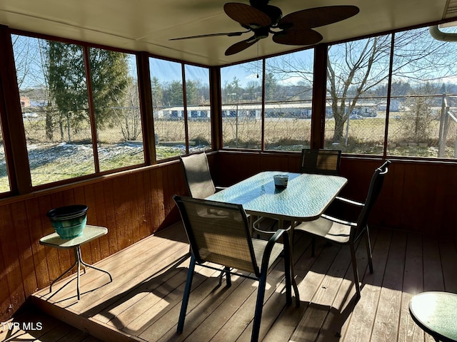 sunroom / solarium featuring ceiling fan