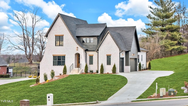 french provincial home featuring a front yard