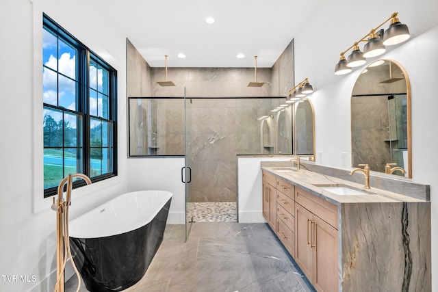 bathroom featuring vanity and separate shower and tub