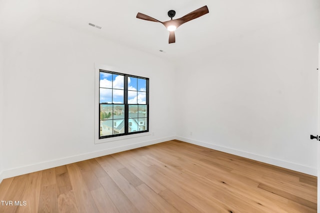 empty room featuring hardwood / wood-style flooring and ceiling fan