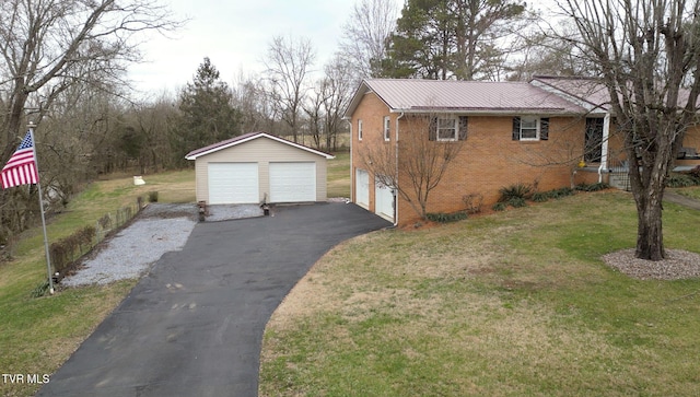 view of side of property featuring a lawn and an outdoor structure